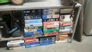 A large quantity of jigsaw puzzles