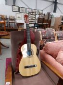 An acoustic guitar with soft case