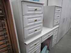 A pair of 3 drawer bedsides and a matching dressing table