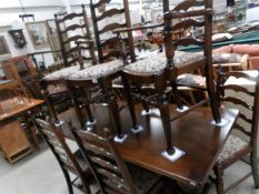 An oak refectory style table and a set of 6 ladder back chairs