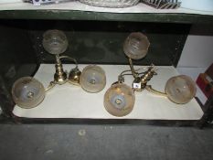 A pair of 3 lamp ceiling lights