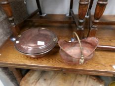 A copper warming pan and a small scuttle