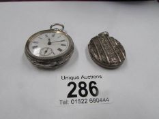 A silver fob watch a/f and a locket