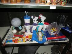 A quantity of Walt Disney World collectibles including drink holders, golfing items, figures,