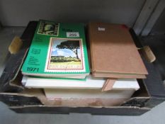 A box of stamp reference books etc