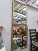 A pair of gilt framed bevel edged mirrors