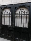 A pair of early wood and metal gates with large lock (some damage to wood,