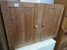 A pine 2 door cupboard