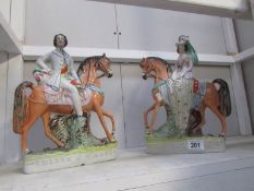 A pair of Staffordshire figures,