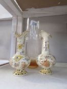 A pair of small pierced vases and an etched Caithness vase