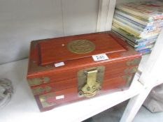 An oriental brass mounted jewellery box
