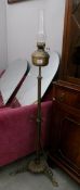 A Victorian brass standard oil lamp converted to electric
