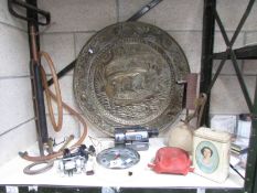 A mixed lot including fishing reels, brass plaque, wall clock, stirrup pump,