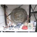 A mixed lot including fishing reels, brass plaque, wall clock, stirrup pump,