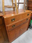 A military cupboard with drop handles