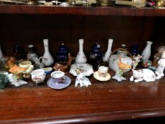 A shelf of miscellaneous ornaments etc