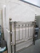 A 4'6" divan bed complete with mattress and metal headboard
