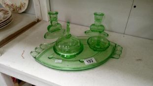 A green glass trinket set