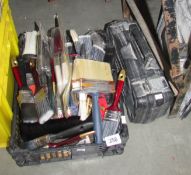 A quantity of new paintbrushes and other tools