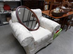 An oval brocade arm chair