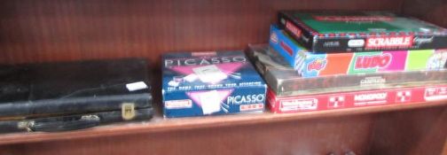 A quantity of games including Monopoly