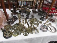 A mixed lot of silver plate and brassware including horse brasses,