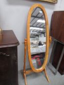 An oval cheval mirror