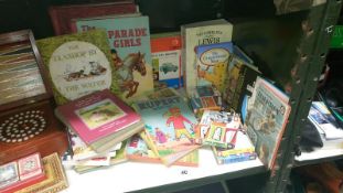 A collection of children's books including Hippo books, I Spy, Observer,