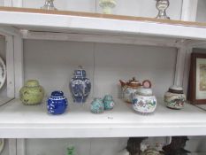 8 oriental lidded ginger jars and a teapot