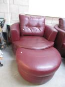 A leather arm chair and stool