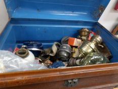 A tin trunk full of oil lamp parts