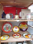 2 chargers and 4 plates of Wedgwood Clarice Cliff ware,