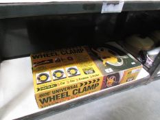 A boxed universal wheel clamp