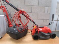 A Flymo mower and a Black and Decker strimmer