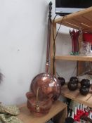 A copper warming pan and a small scuttle