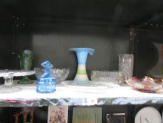 A shelf of assorted glass ware including carnival glass bowl