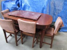 An extending table and 4 chairs