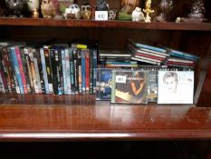 A quantity of CD's and DVD's