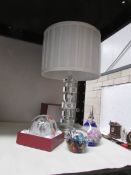 A table lamp and 3 glass paperweights