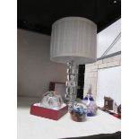 A table lamp and 3 glass paperweights