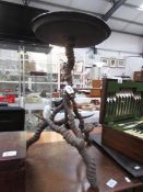 A brass topped table with antler base