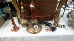 A brass bell and other items