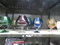 7 large coloured glass brandy goblets