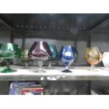 7 large coloured glass brandy goblets