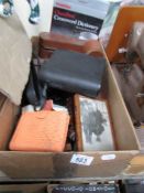 A box of miscellaneous items including binoculars