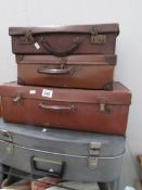 4 vintage suitcases