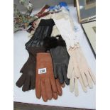 A mixed lot of gloves and scarves etc