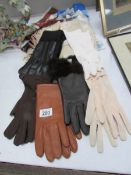 A mixed lot of gloves and scarves etc