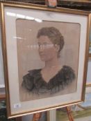 A framed and glazed portrait print of a lady