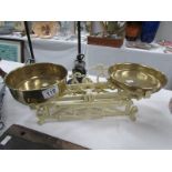 A set of old continental scales with brass pans and weights